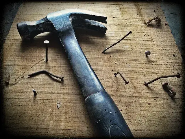 A hammer and nails, Cost To Replace A Roof On A 3000-Square-Foot House  