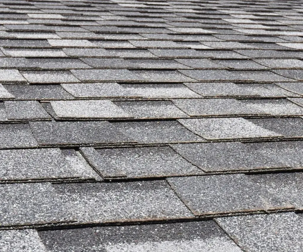 Composition shingles on a new roof close up