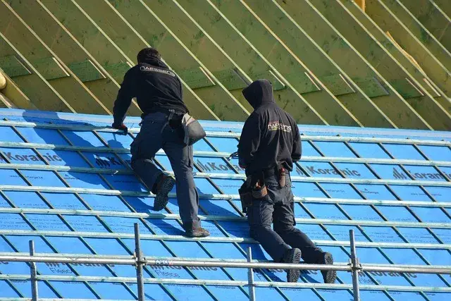 Roofers on a roof