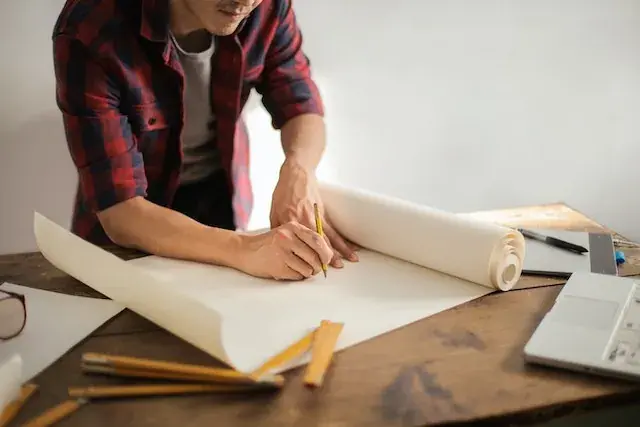A man working on building plans