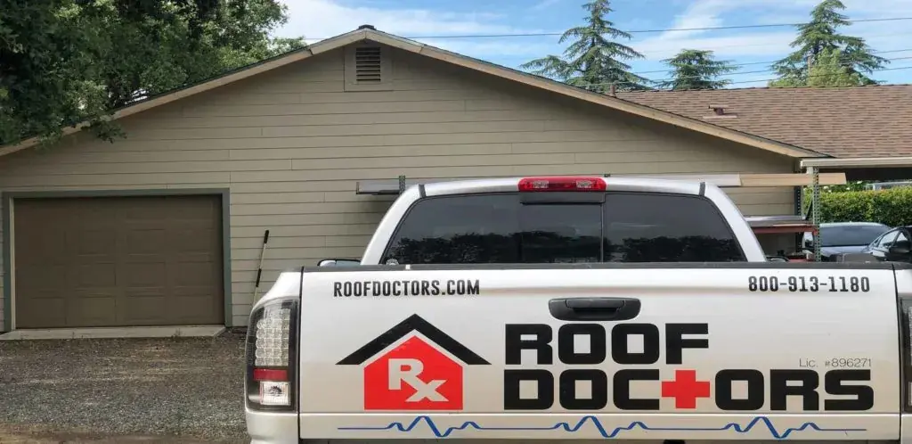 a white police vehicle parked in front of a house