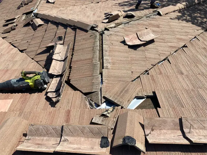 Wood shake roof with the hip opened up and shakes removed for access