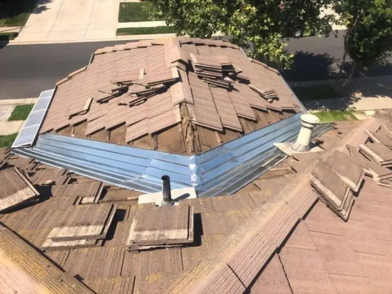New metal flashing installed with the concrete tile staged before it was re-laid