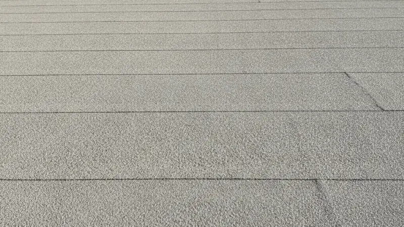 Modified bitumen roof surface with granulated cap sheet and torch-fused laps on a commercial roof