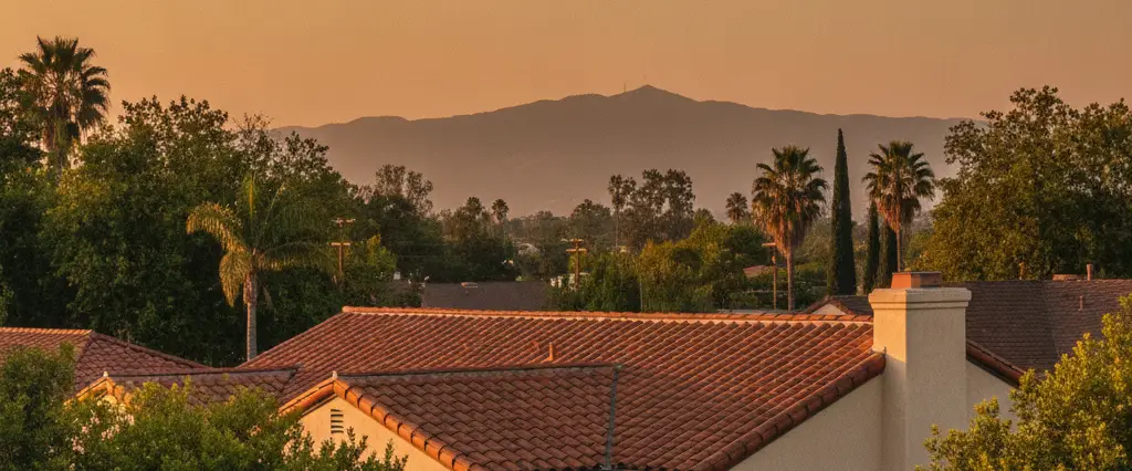 Well-maintained residential rooftops in Arcadia, Los Angeles County, California, with hazy coastal hills beyond