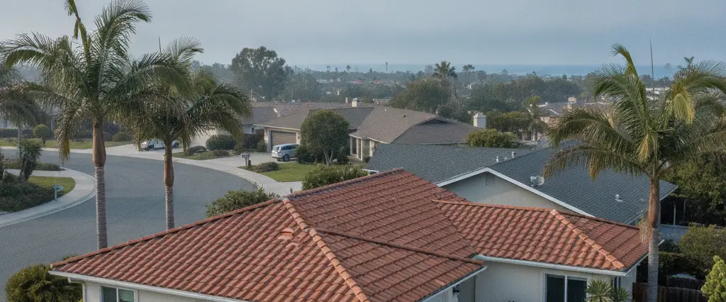 Well-maintained residential rooftops in Ventura, Ventura County, California, with hazy coastal hills beyond