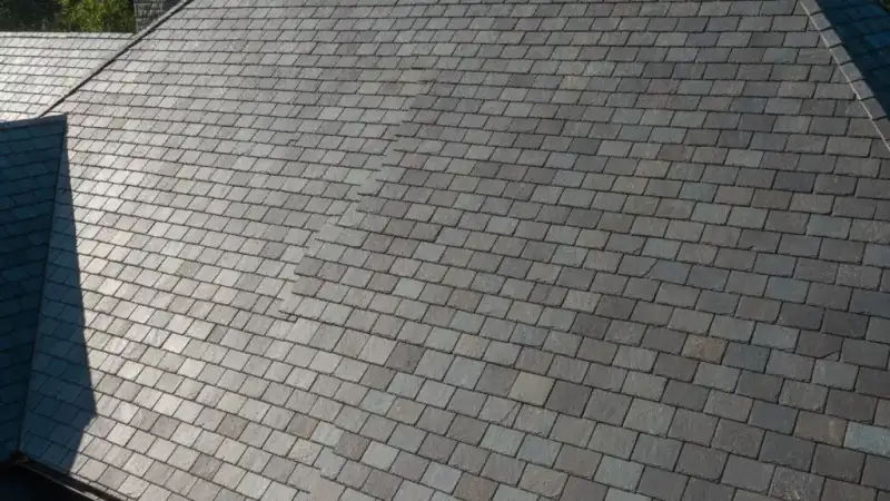 Natural slate roof on a home with overlapping stone tile courses