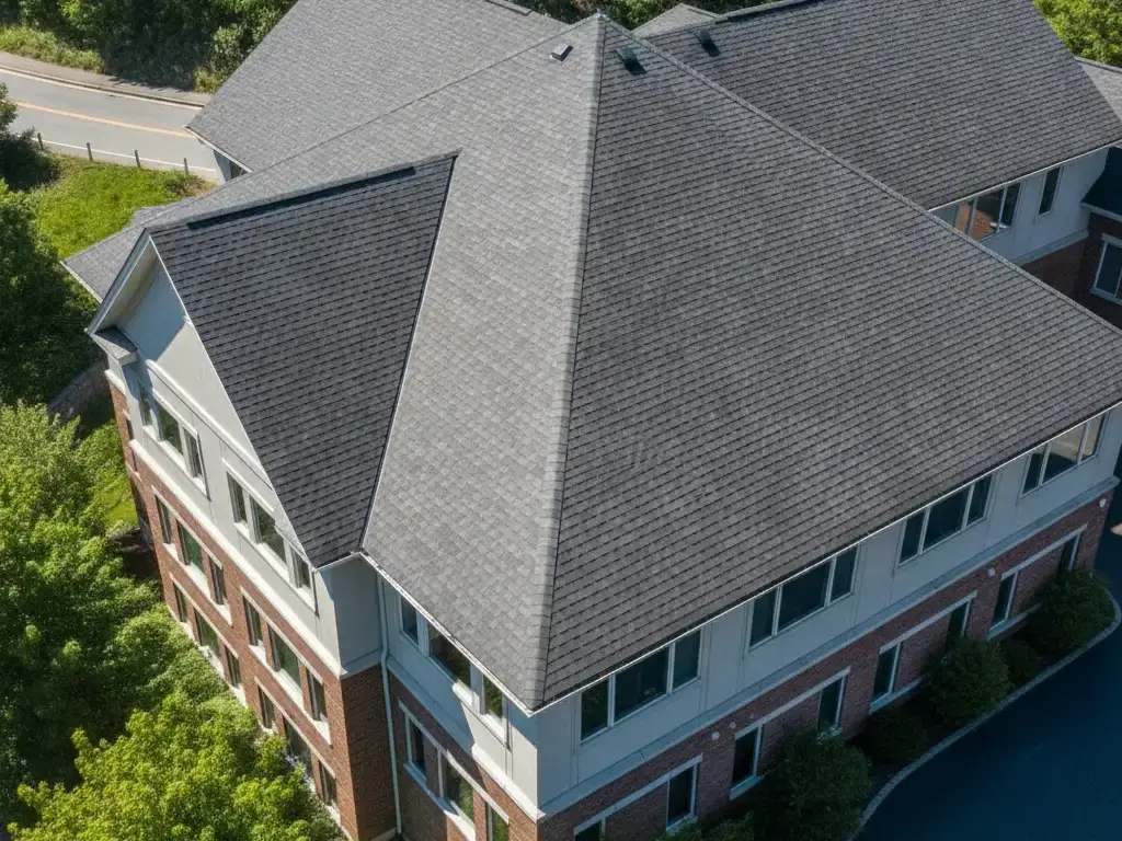 Steep-slope commercial building with a new asphalt shingle roof