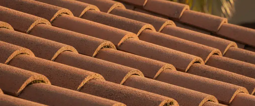 Close-up of a concrete tile roof on a California home in warm afternoon light