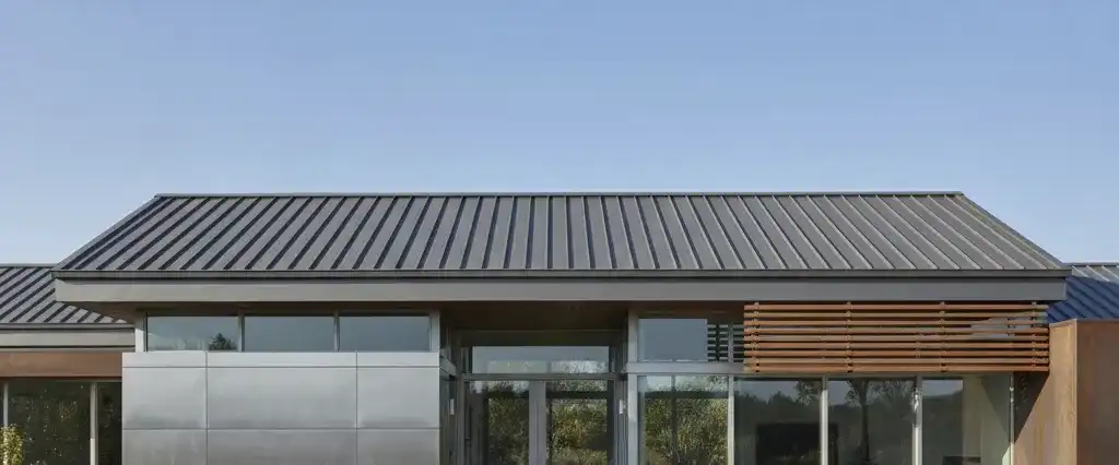 A metal roof on a modern single-story California home in afternoon light