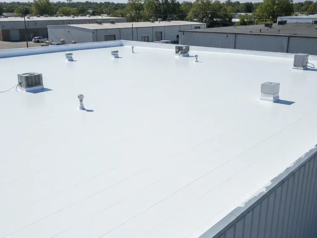 Commercial flat roof restored with a reflective coating