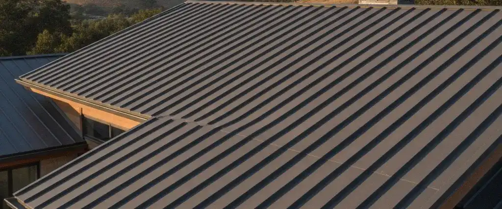 A standing seam metal roof with clean vertical seams on a modern California home