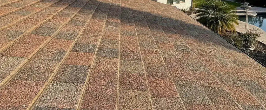 A stone-coated steel roof with a textured stone-chip finish on a California home