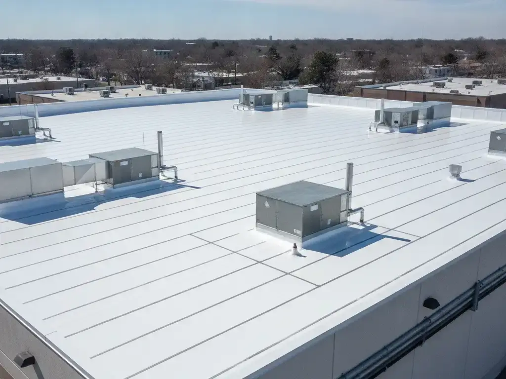 Commercial building flat roof with a white TPO membrane