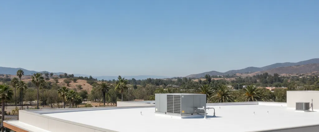 Modern California building with a clean white TPO membrane flat low-slope roof
