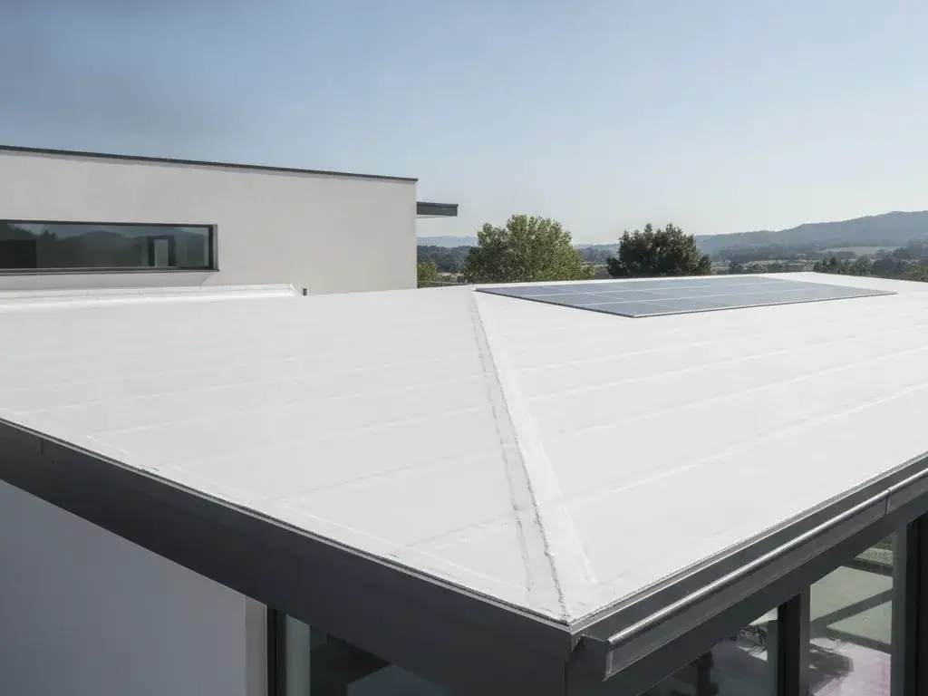 Modern low-slope residential roof with a white TPO membrane