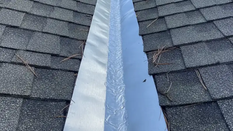 Metal valley flashing where two residential roof slopes meet