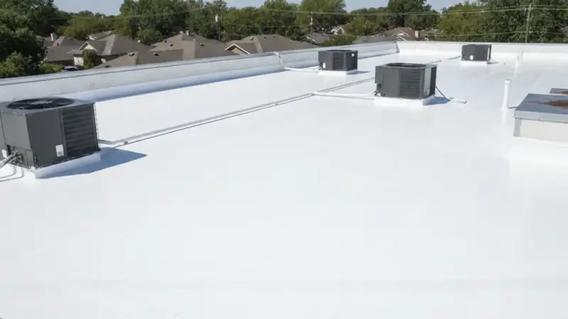 Flat commercial roof with a bright white reflective restorative coating for energy savings