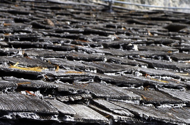 A damaged wood shinge roof