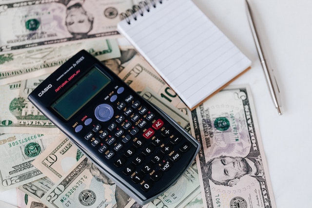 A calculator beside money