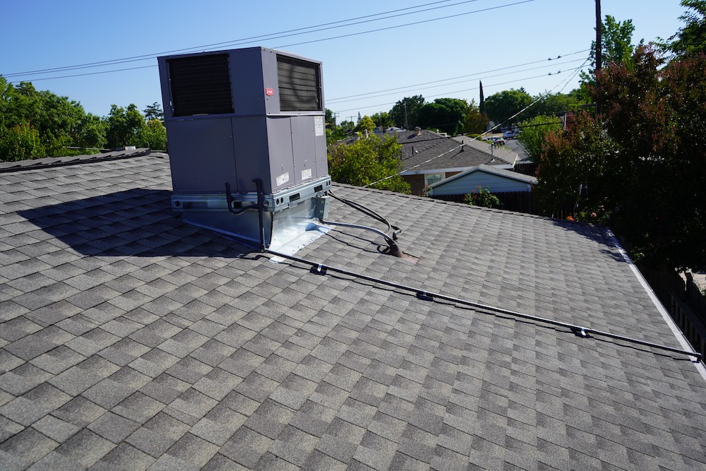Newly shingled roof with a ac unit